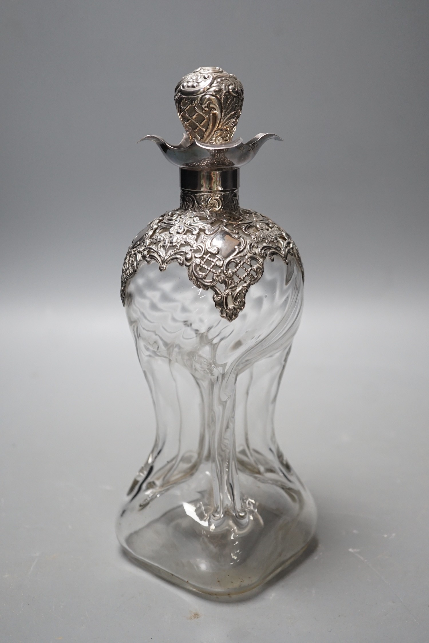 A late Victorian silver mounted waisted glass decanter and stopper, Henry Matthews, Birmingham, 1899, height 24cm.